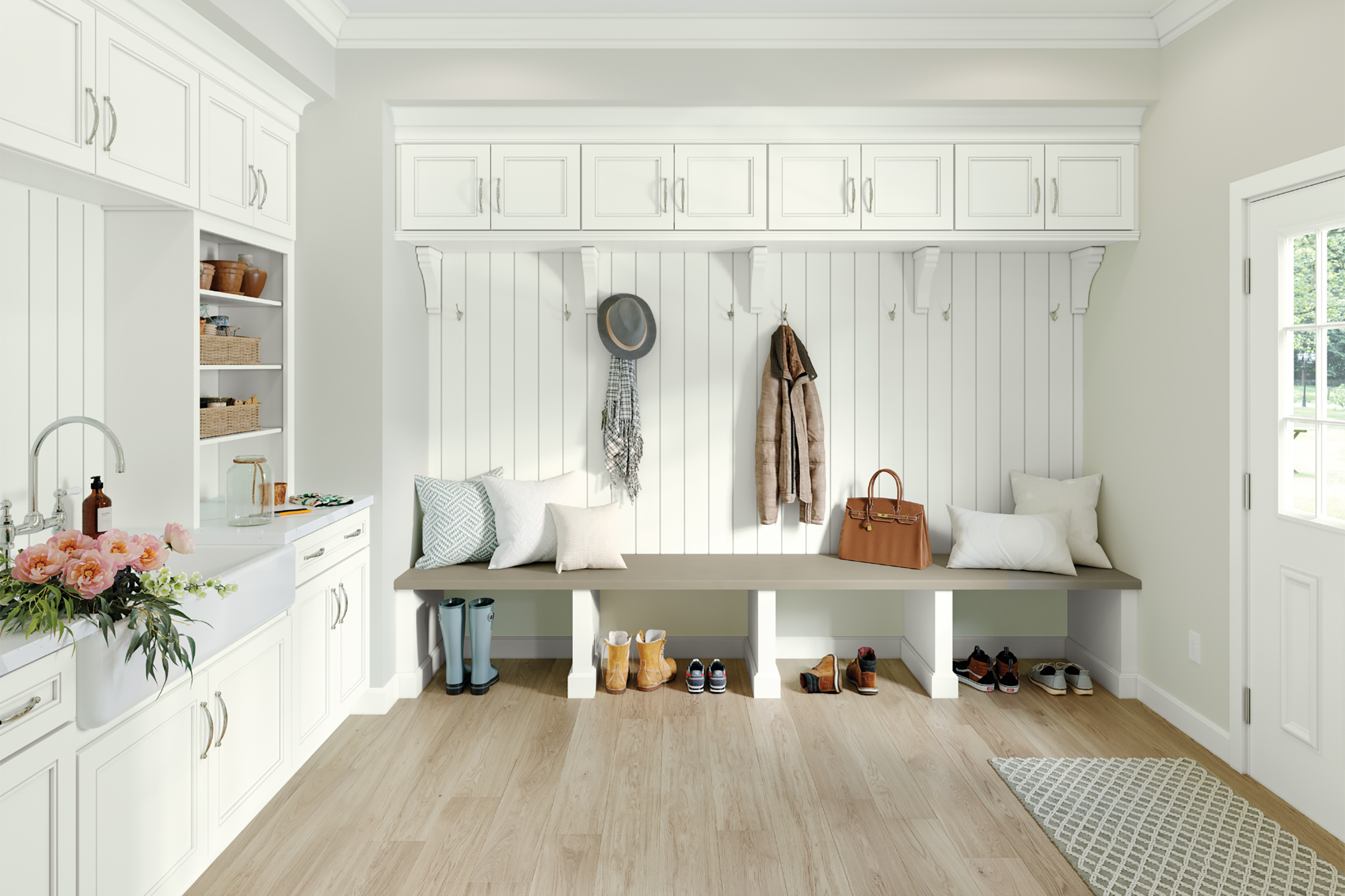 KraftMaid white mudroom cabinets with utility sink